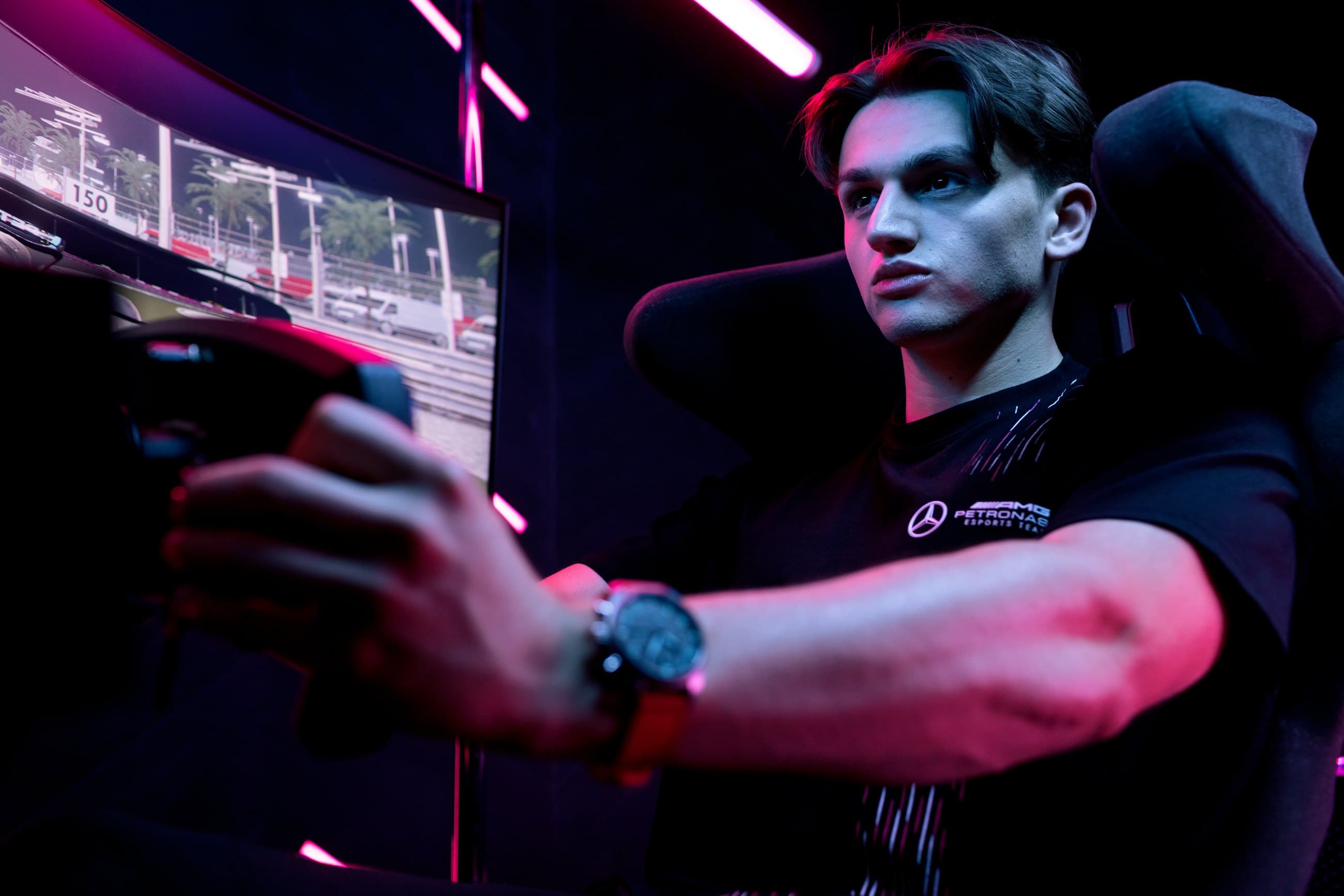 Marcel Kiefer at the wheel of a simulator, lit red